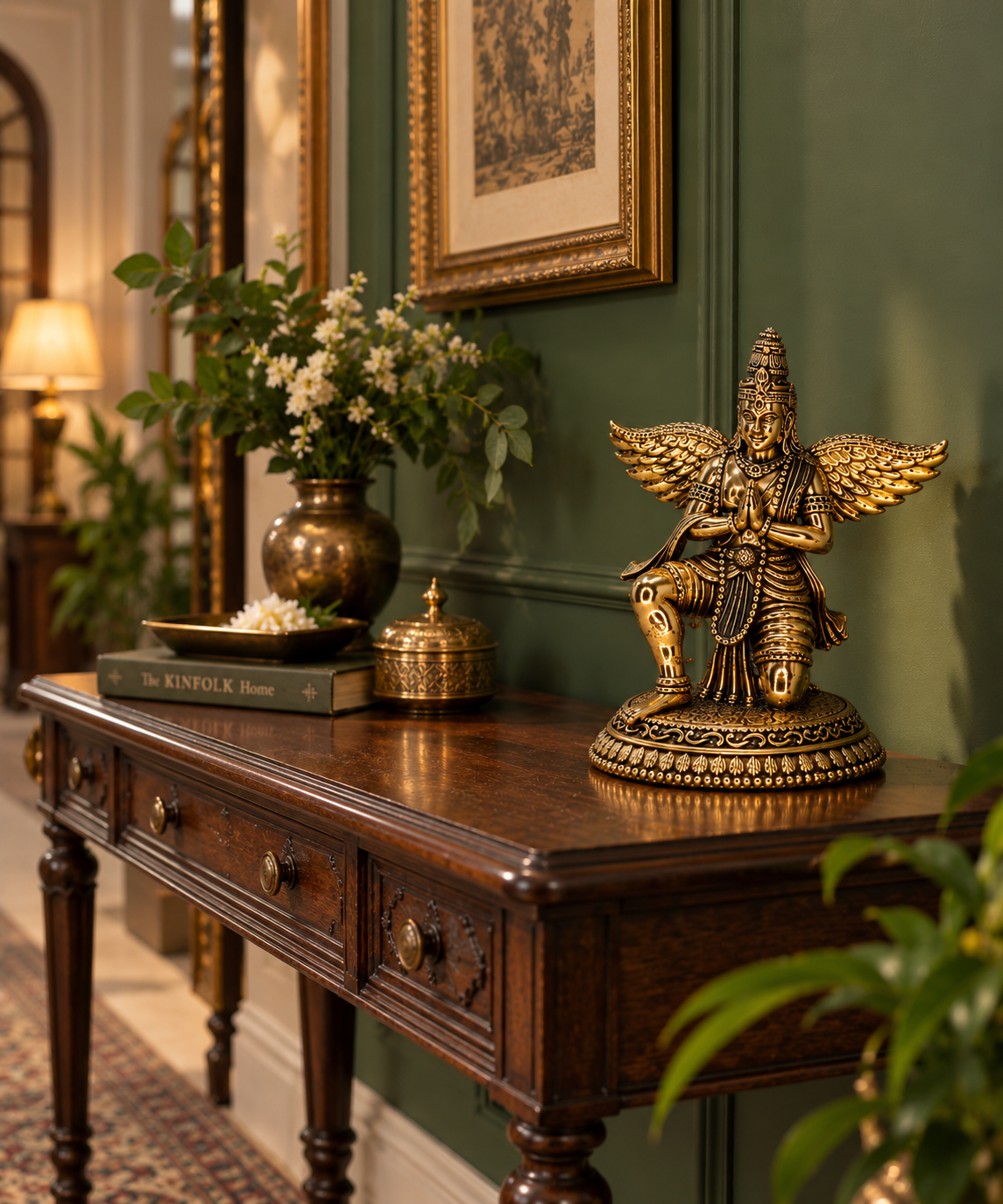 Antique brass Garuda statue, a traditional brass pooja item featuring detailed craftsmanship, suitable for religious altar decoration.