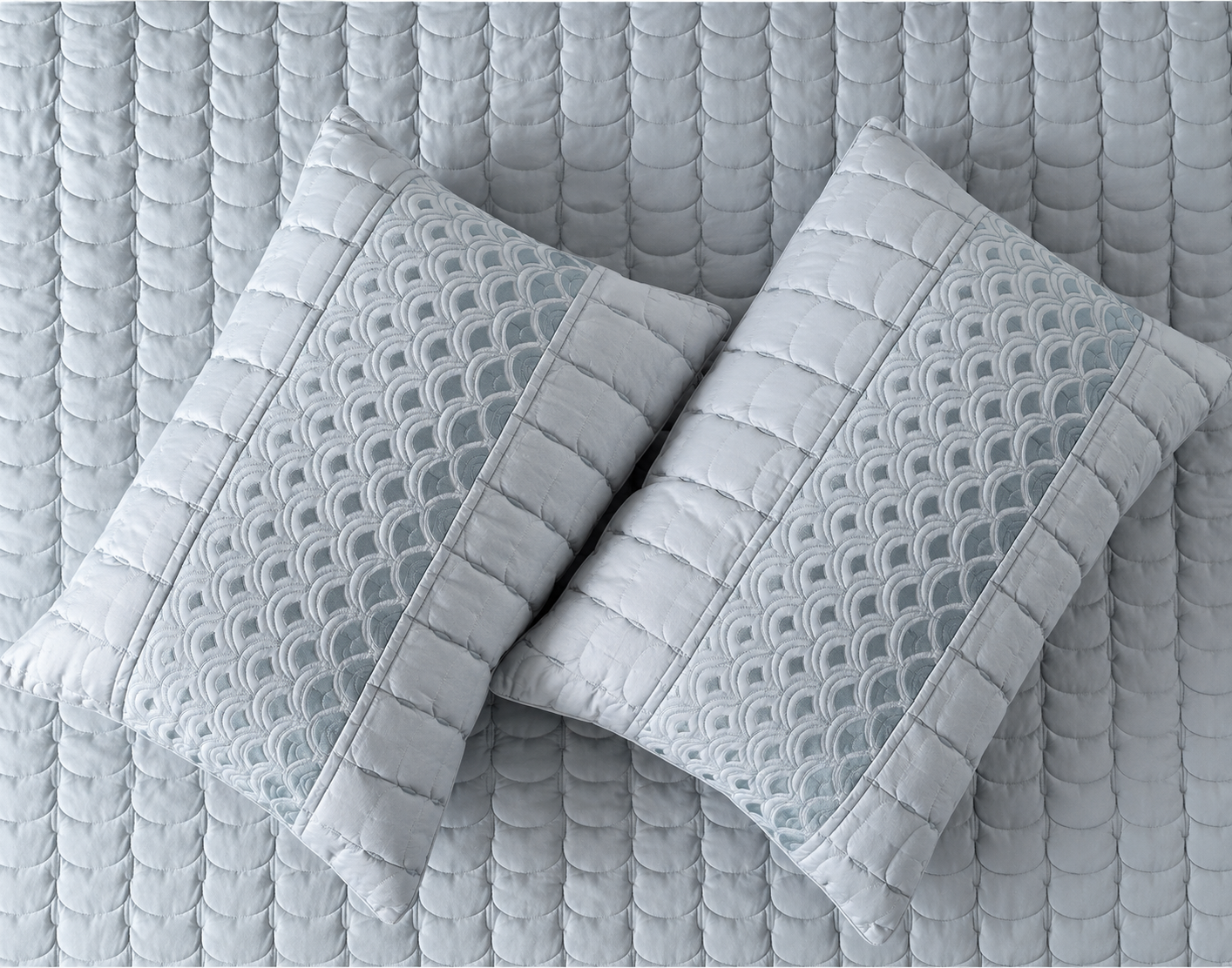 Luxury bedding set by The Gharnish with serene wave stitch pattern, includes five pieces of soft, stylish bed linens.