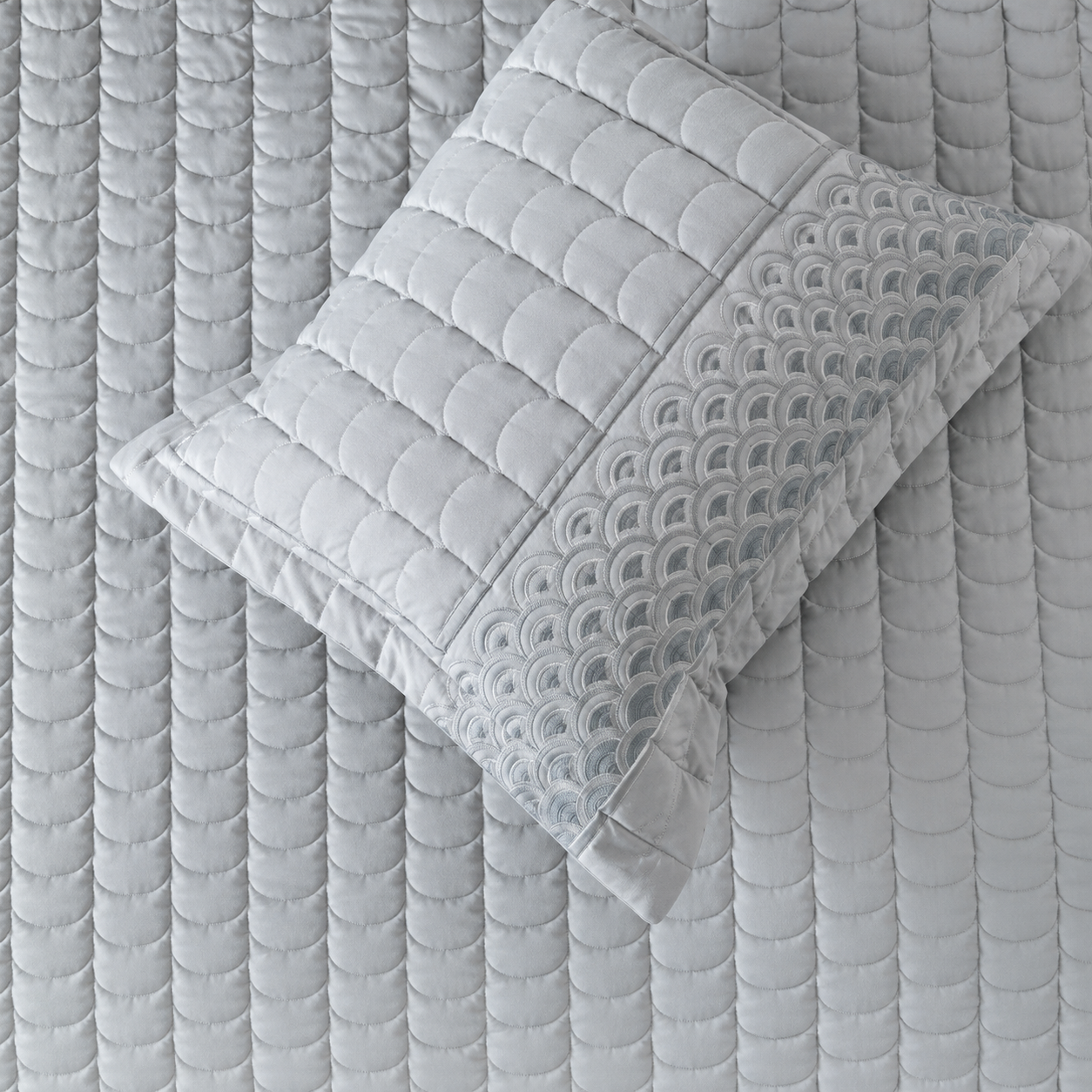 Luxury bedding set with serene wave stitch design, including five pieces from The Gharnish, featuring soft fabric and elegant pattern.