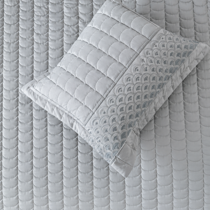 Luxury bedding set with serene wave stitch design, including five pieces from The Gharnish, featuring soft fabric and elegant pattern.