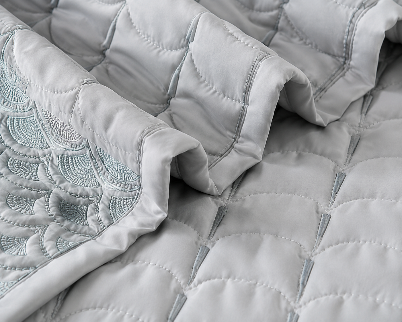 Luxurious Serene Wave Stitch bedding set by The Gharnish with five pieces, featuring elegant wave stitch design in soft, inviting fabrics.