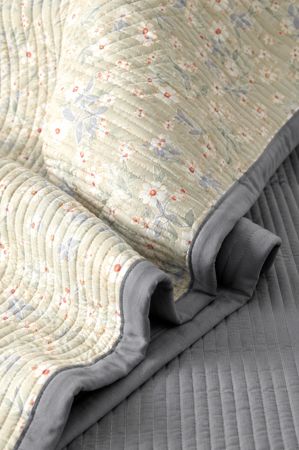 Floral bedding set of 3 with quilted bedcover and two matching pillow covers from The Gharnish. Soft, colorful bed linens.