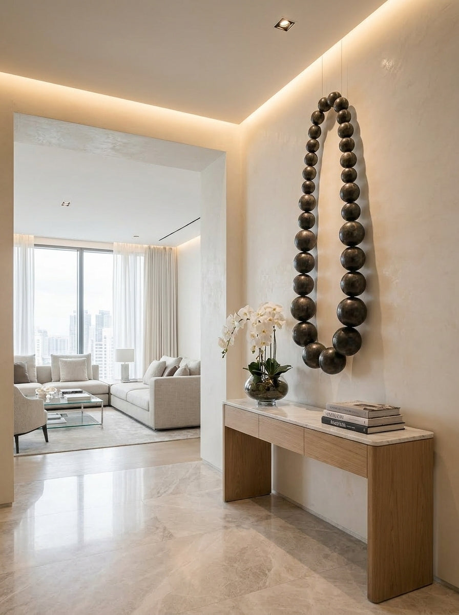 Obsidian bead wall sculpture by The Gharnish, modern wall art featuring glossy black beads arranged in an artistic design.