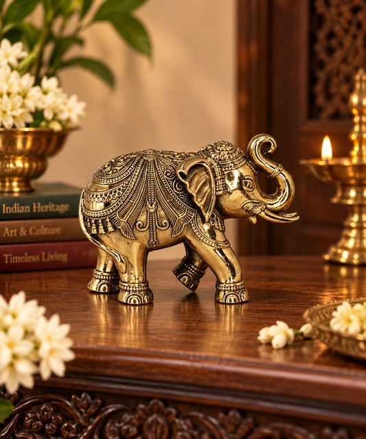 Antique brass elephant statue, traditional South Indian heritage décor, crafted for pooja and spiritual decoration.