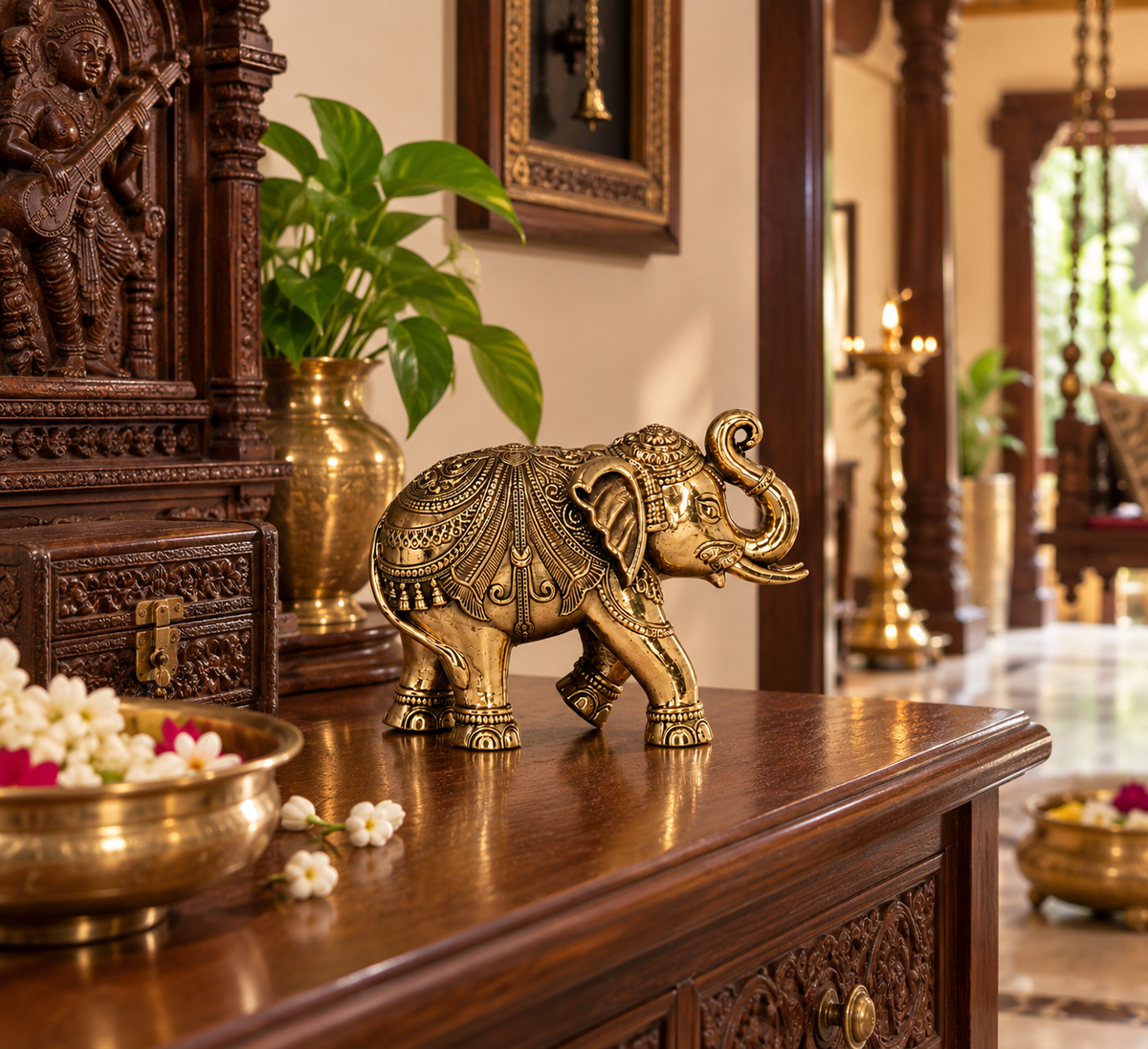 Antique brass elephant statue from The Gharnish, traditional South Indian heritage décor, used as a brass pooja item or decorative piece.