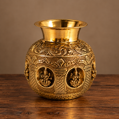 Antique brass Ashta Lakshmi Kalash for traditional pooja and Vastu décor, crafted by The Gharnish, featuring intricate detailing.
