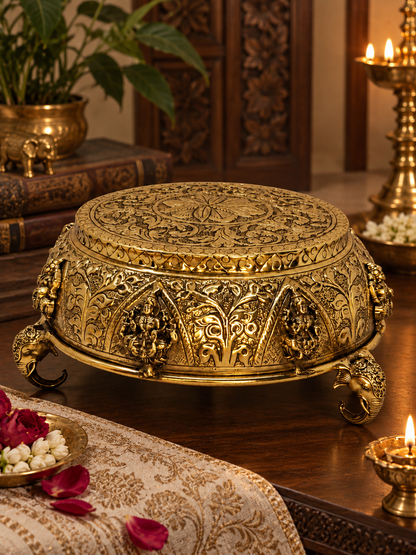 Antique brass Astalakshmi carved chowki from The Gharnish, ornate puja aasan and decorative pedestal for spiritual offerings.