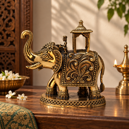 Antique brass Eravat elephant with ornate howdah, traditional brass pooja item from The Gharnish, detailed craftsmanship, decorative design