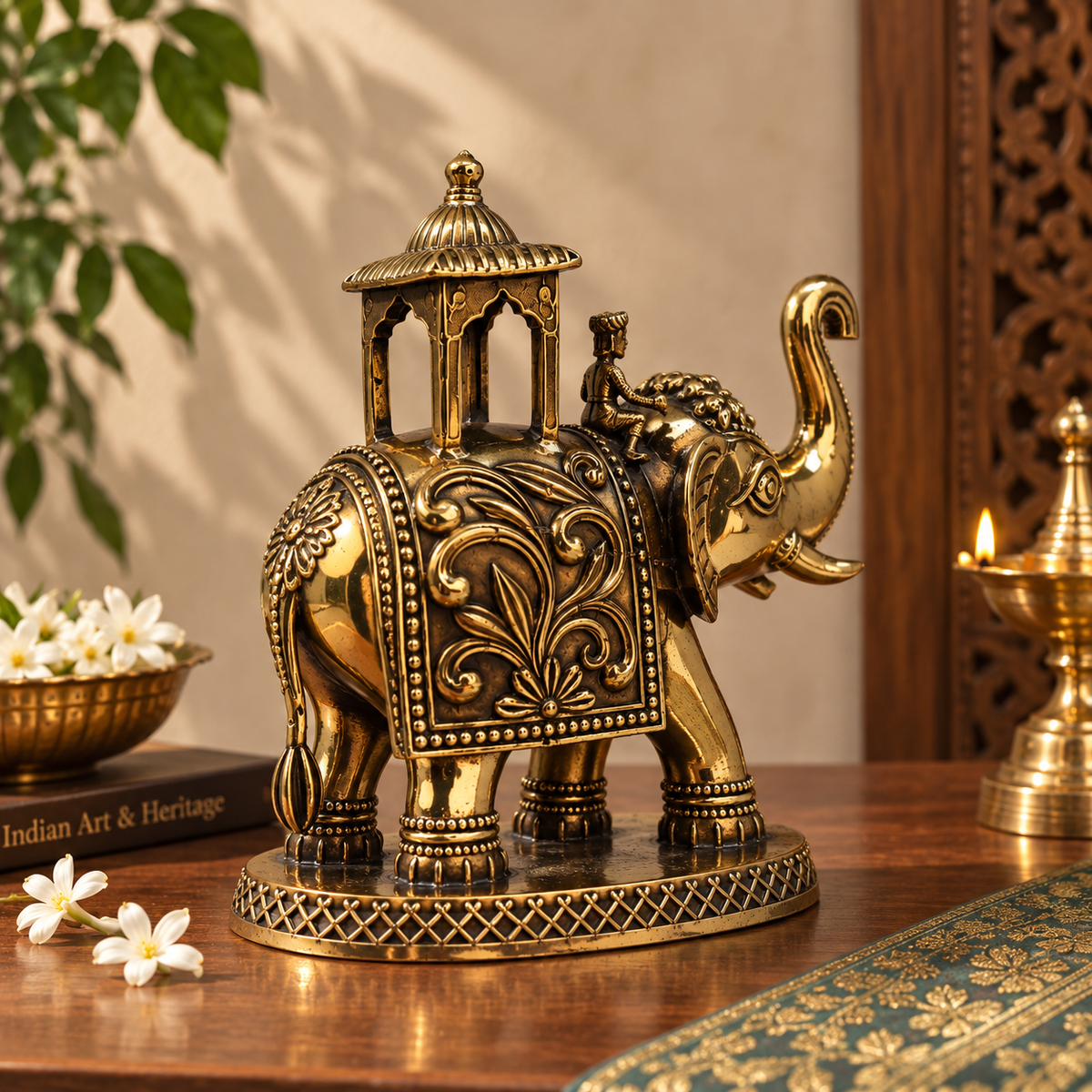 Antique brass Eravat elephant with ornate howdah, traditional brass pooja item from The Gharnish, detailed craftsmanship for religious rituals.