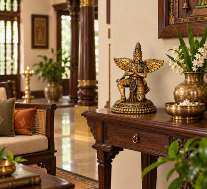 Antique brass Garuda statue, a traditional brass pooja item with detailed craftsmanship, ideal for spiritual or decorative use.