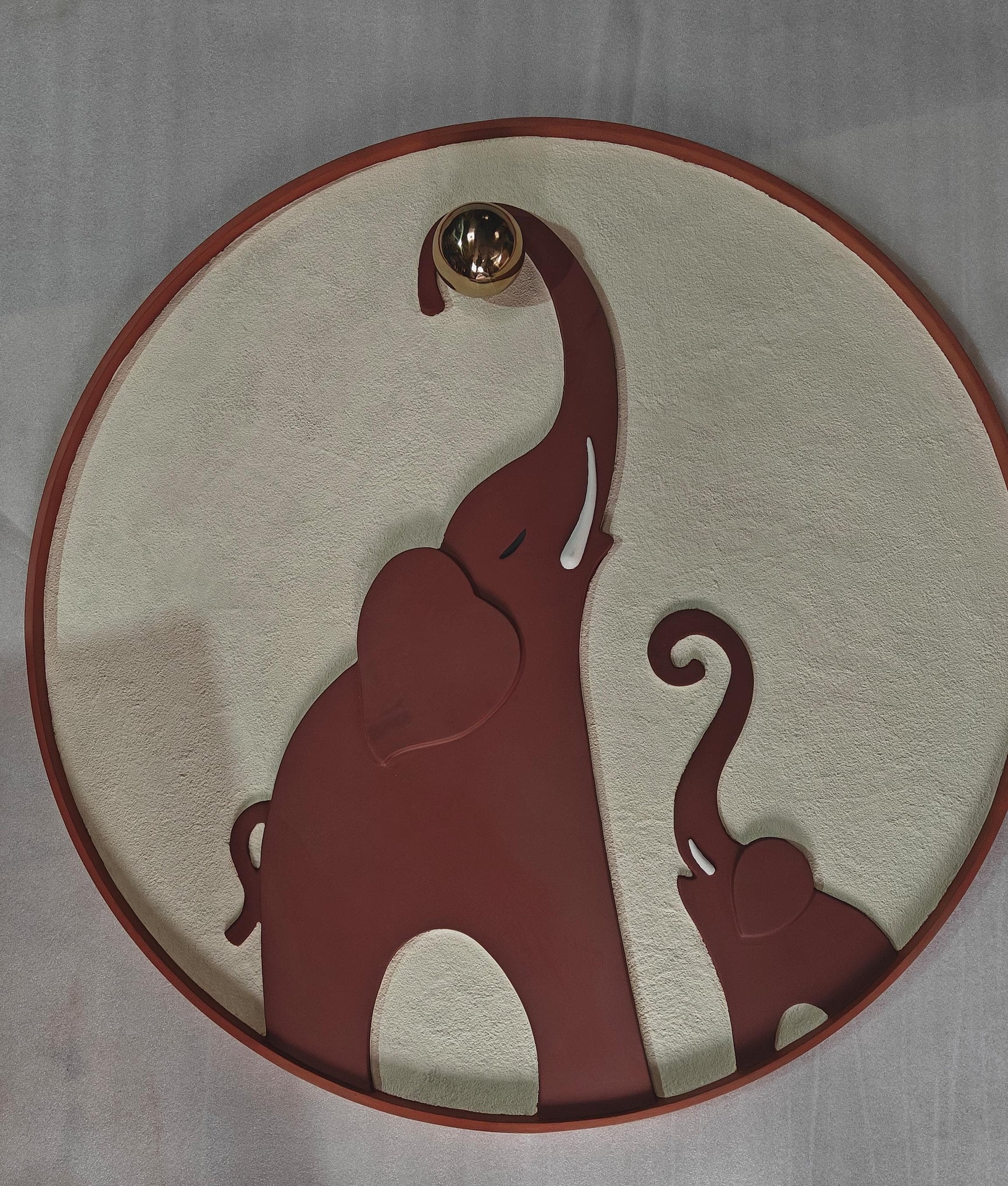 Decorative plate with an elephant design on a plain background