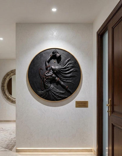 Decorative wall sculpture of a person in a flowing dress on a light gray wall.