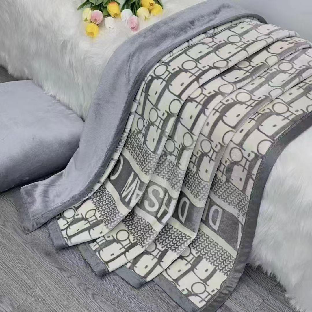 Flannel blanket with geometric pattern on a couch