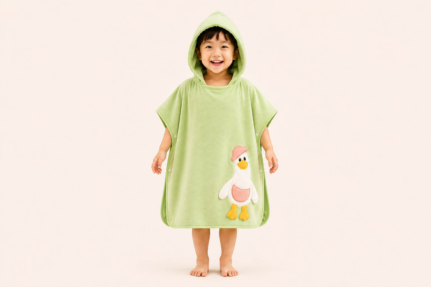 Green DuckieHug Kids hooded bath poncho towel with a playful duck design, ideal for children’s bath time.