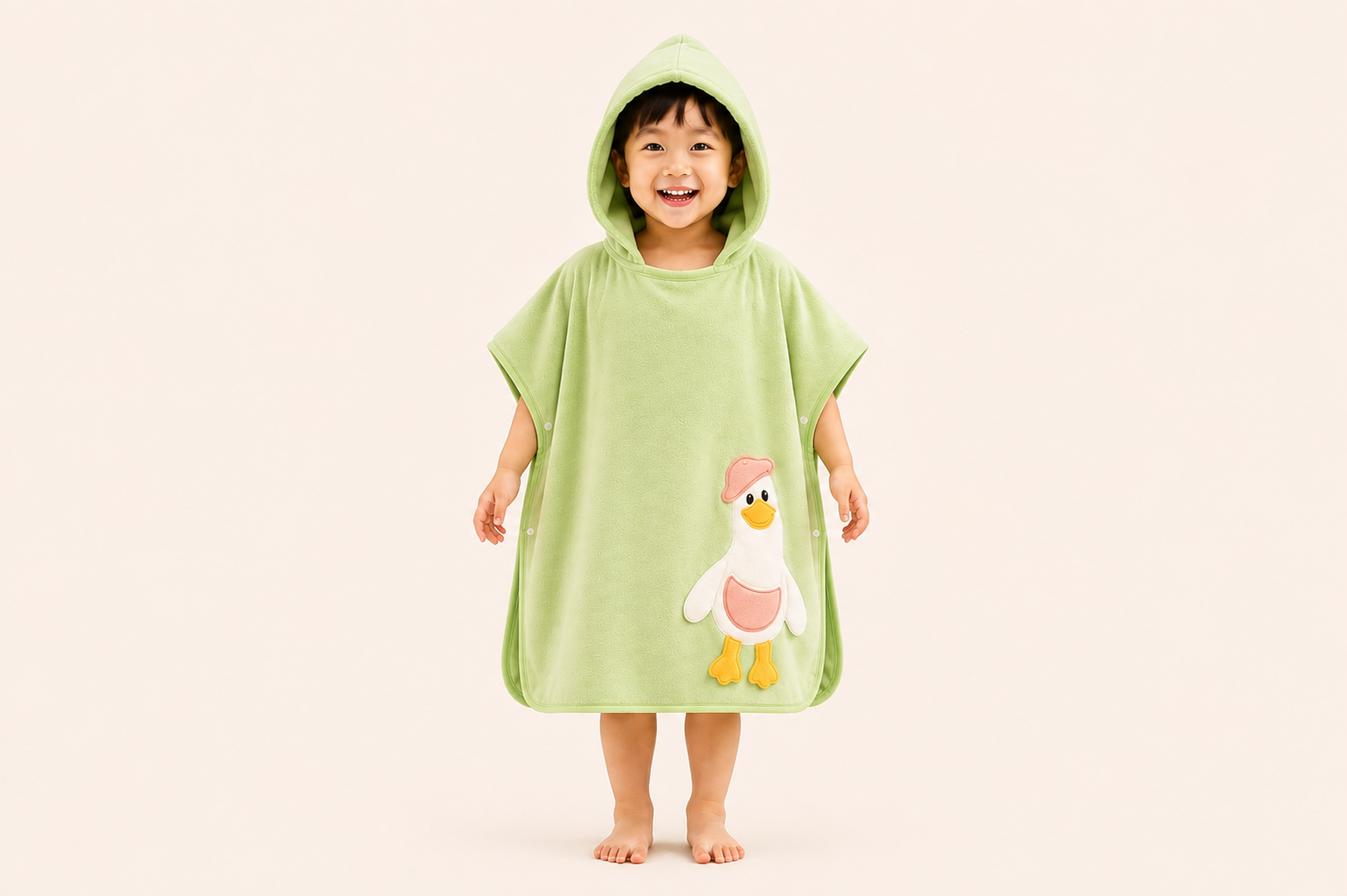 Green DuckieHug Kids hooded bath poncho towel with a playful duck design, ideal for children’s bath time.