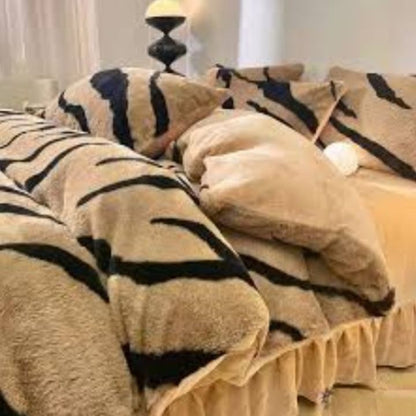 Zebra Print Faux Fur Blanket Set. Crafted with ultra-soft, high-density faux fur, this blanket brings a bold and exotic flair to your space with its striking black and white zebra pattern.