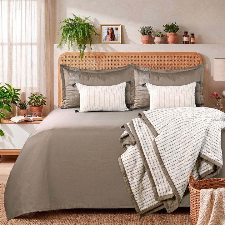 Luxury cotton bedding set from The Gharnish featuring a bedsheet, embroidered comforter, and pillow covers in a plush king size.