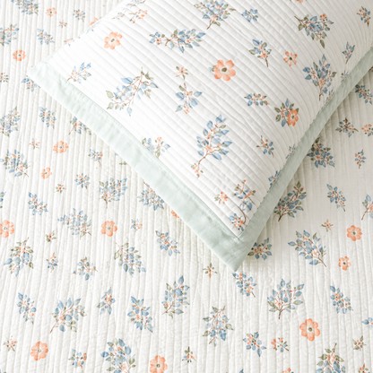 Soft floral bedding set of 3 from The Gharnish featuring a quilted bedcover and two matching pillow covers.