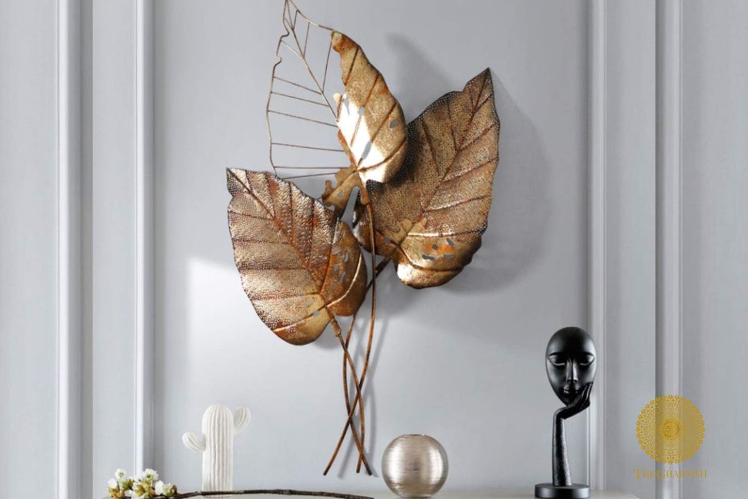 Metallic wall art featuring three Pipal leaves, decorative wall accent by TheGharnish with intricate leaf details.