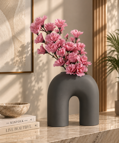 Matte grey arch flower vase by TheGharnish, minimalist design with a smooth surface and modern shape for floral arrangements.