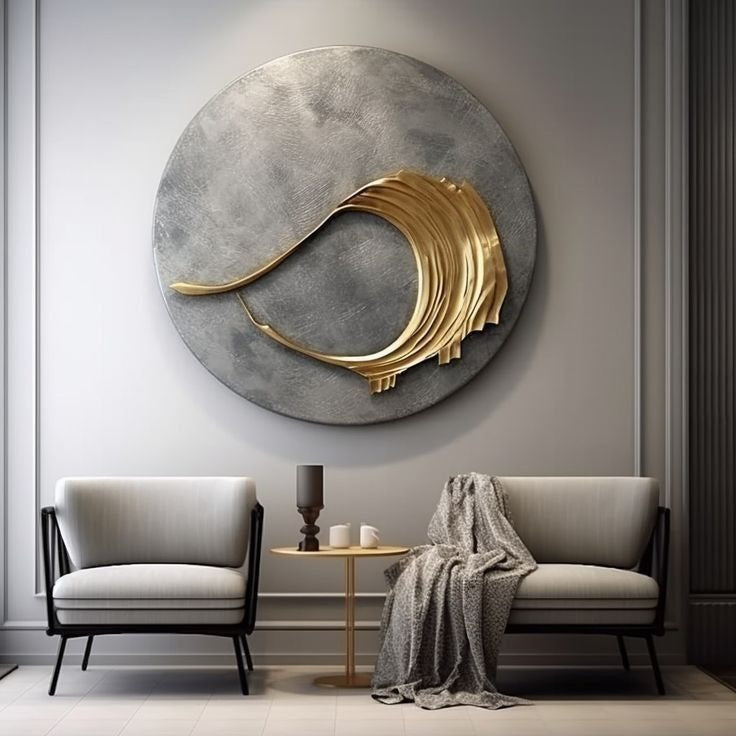 Modern living room with a gold and gray wall sculpture, white sofa, and armchair.