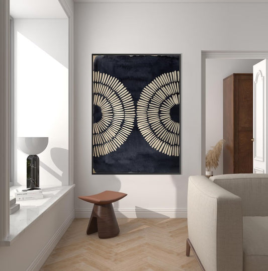 Modern interior with abstract wall art, wooden stool, and white sofa.