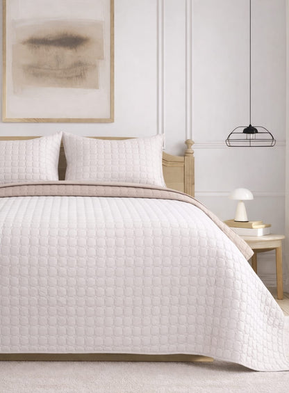 Soft and snug pastel quilted bedcover set by The Gharnish, featuring a luxurious reversible 3-piece bedding set.