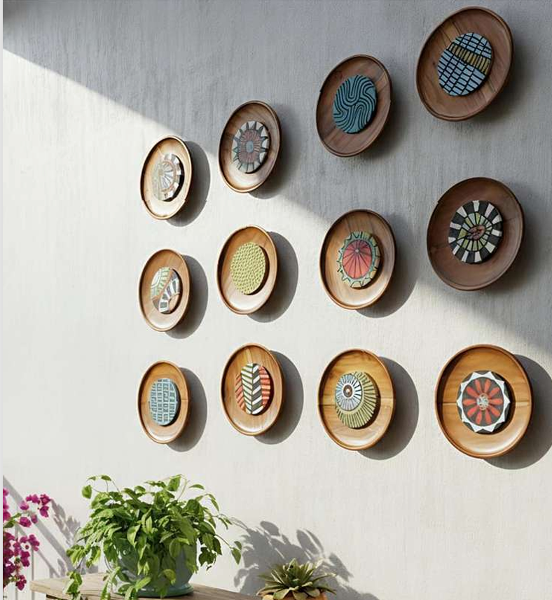 Set of 12 handcrafted wooden wall sculpture panels with intricate carvings, framed and displayed as decorative art decor.