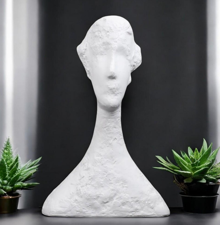 Abstract artisan figurine by The Gharnish, showcasing contemporary design with smooth, modern lines and a unique artistic form.