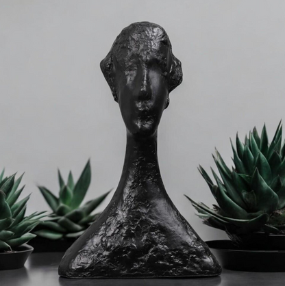 Abstract artisan figurine by The Gharnish, contemporary sculpture with flowing, modern design and intricate detailing.