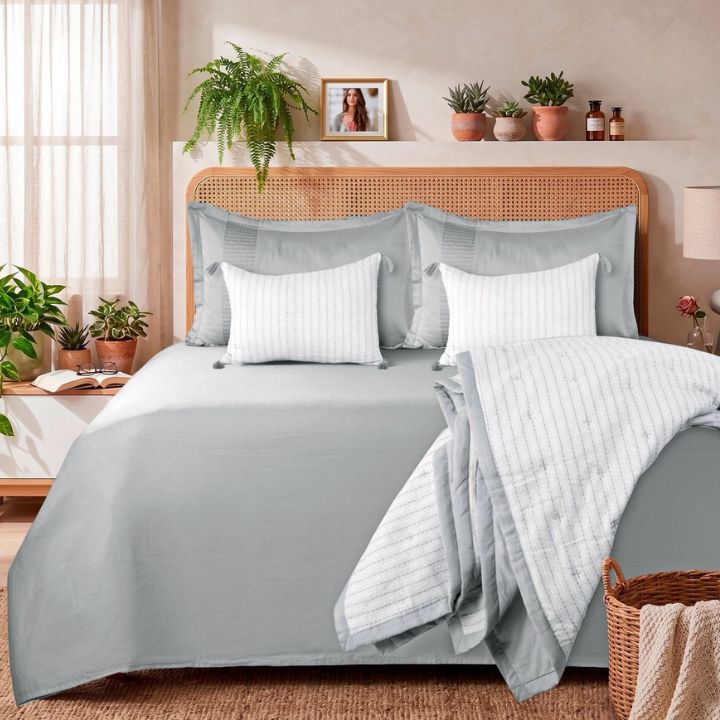 Luxurious cotton bedding set by The Gharnish featuring an embroidered comforter, bedsheet, and pillow covers in soft, premium fabric.