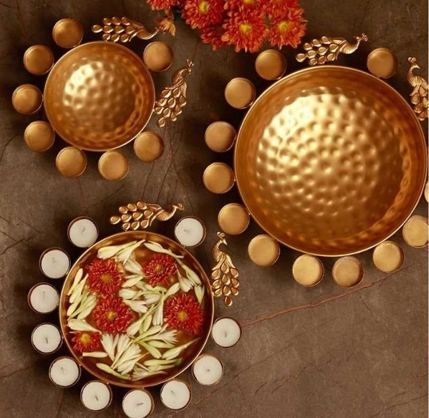 This Diwali decorate your home with a set of 5 peacock urli set 