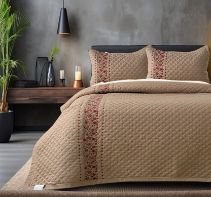 Blush Blossom quilted bedding set by The Gharnish featuring a floral pattern on a soft, pastel-colored bedcover.