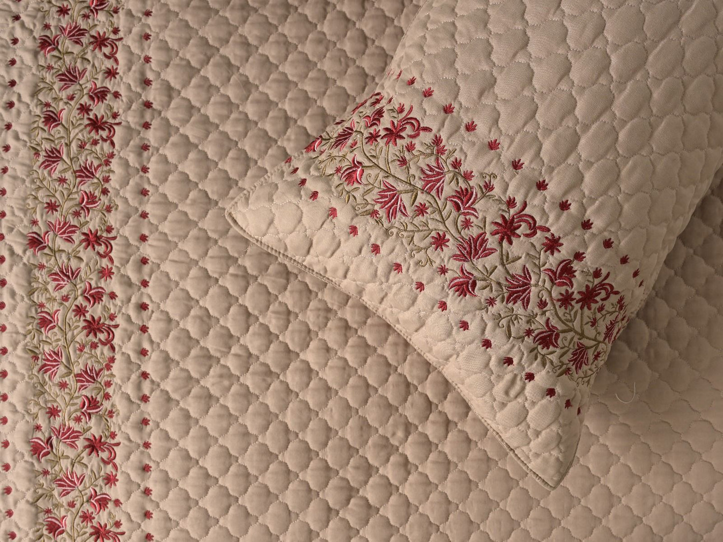 Blush Blossom quilted bedding set by The Gharnish featuring a soft, floral design perfect for a cozy bedroom decor.