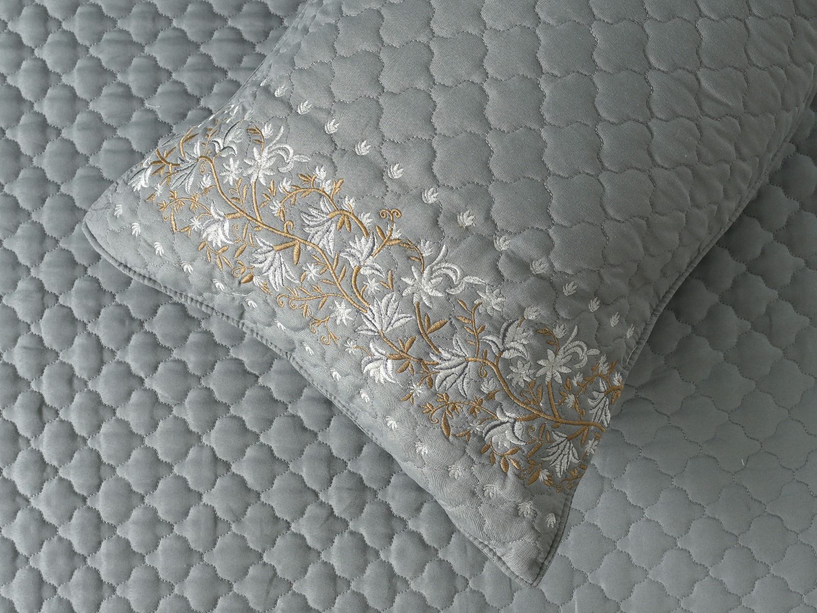 Blush Blossom quilted bedcover set by The Gharnish, featuring a soft pink floral design on a cozy bedding ensemble.
