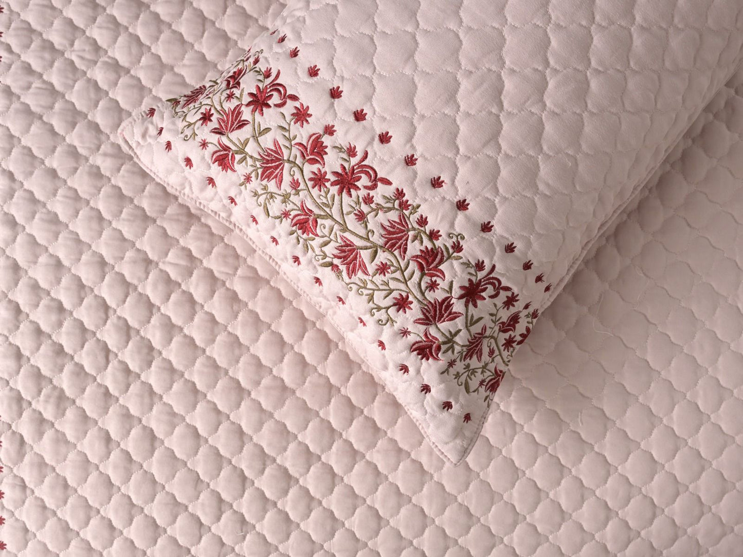 Blush blossom quilted bedding set by The Gharnish with floral pattern and soft, textured fabric for a cozy bedroom look.