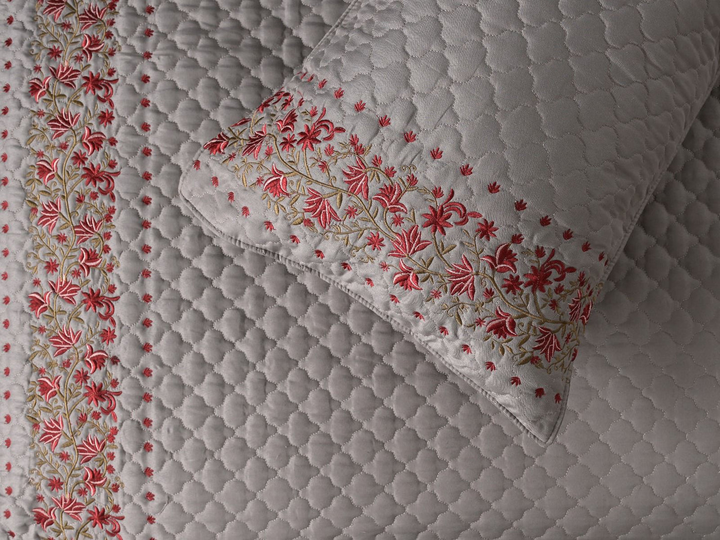 Blush Blossom quilted bedcover set from The Gharnish, featuring a soft pink floral design on a cozy bedding set.