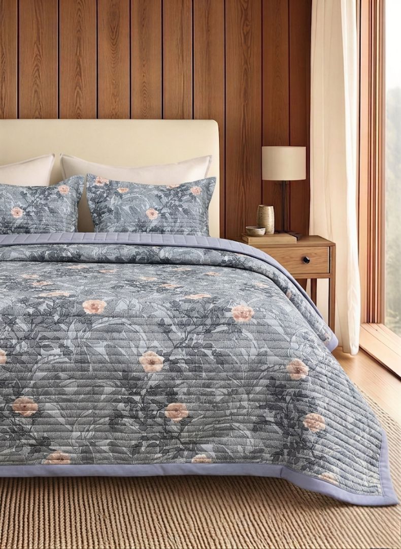 Luxury soft floral quilted bedding set with matching pillow covers by The Gharnish, featuring intricate floral patterns and plush fabric.