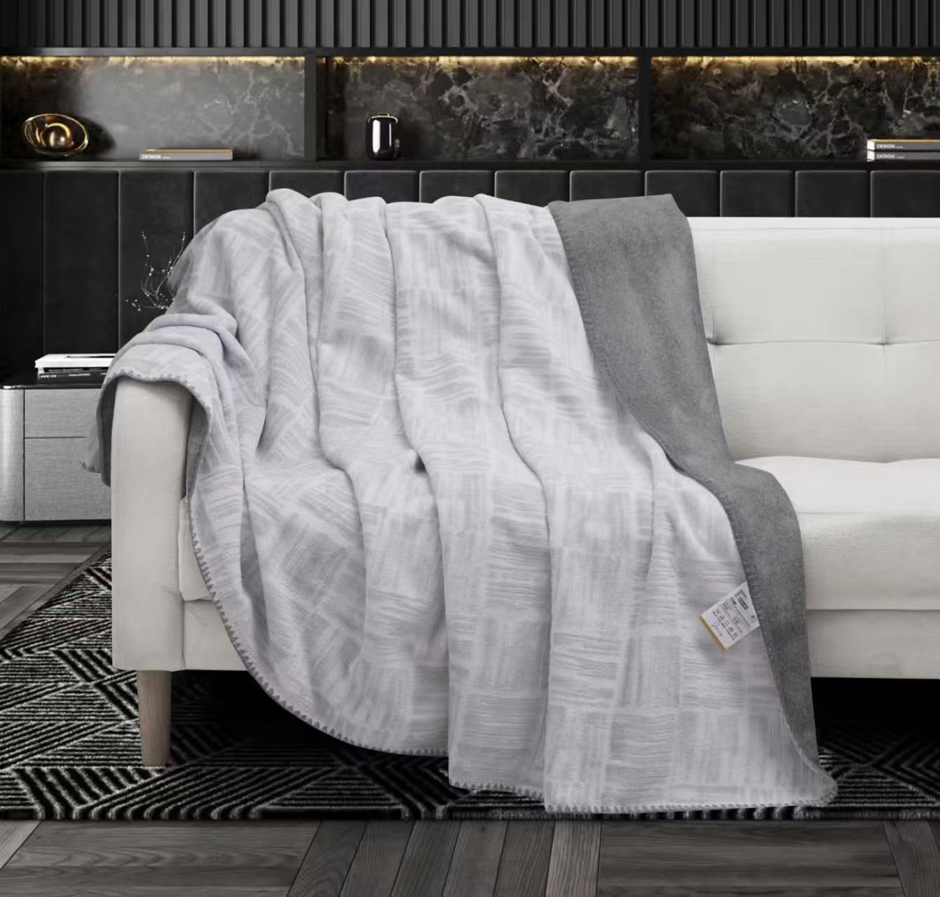 Lightweight The Gharnish Premium AC Blanket in soft fabric, shown folded on a neutral surface, designed for comfort and style.
