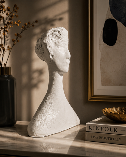 Abstract artisan soul figurine by The Gharnish, white sculpture on a table, showcasing modern contemporary design.