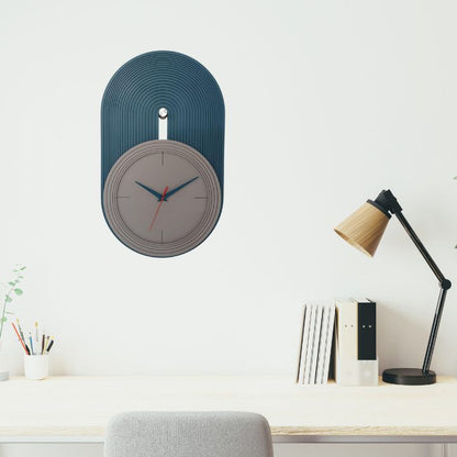 Elevate your home decor with our Modern Nordic Wall Clock, a perfect blend of minimalist design and functional elegance. Featuring a matte grey dial set against a teal blue arched panel with fine grooves, this clock adds a contemporary touch to any living room, bedroom, or office space. The sleek blue and red hands ensure precise timekeeping,deal for lovers of Scandinavian and modern aesthetics.