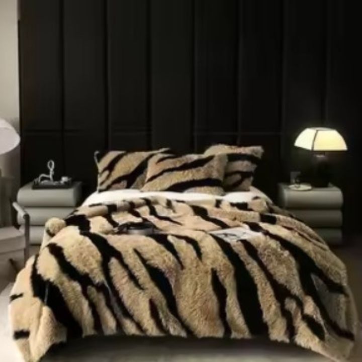 Zebra Print Faux Fur Blanket Set. Crafted with ultra-soft, high-density faux fur, this blanket brings a bold and exotic flair to your space with its striking black and white zebra pattern.
