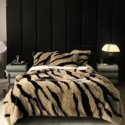 Zebra Print Faux Fur Blanket Set. Crafted with ultra-soft, high-density faux fur, this blanket brings a bold and exotic flair to your space with its striking black and white zebra pattern.