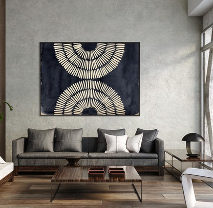 Modern living room with a gray sofa, abstract wall art, and wooden coffee table.