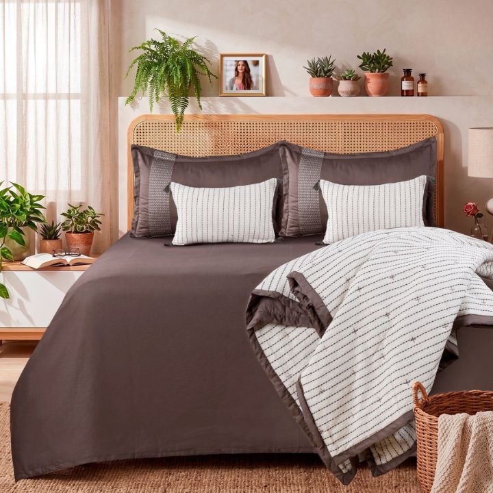 Luxury cotton bedding set by The Gharnish featuring an embroidered comforter, bedsheet, and pillow covers in soft, premium fabric.