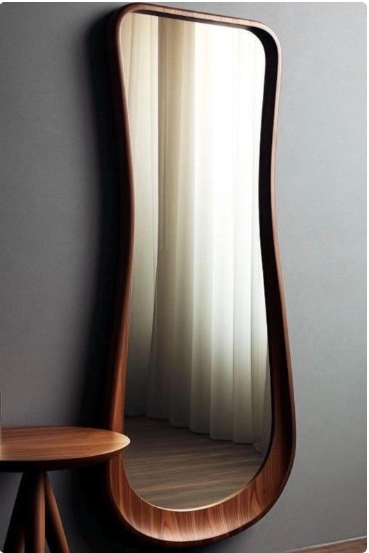 Long wavy bathroom mirror by The Gharnish, asymmetrical irregular design, perfect for vanity or home decor.