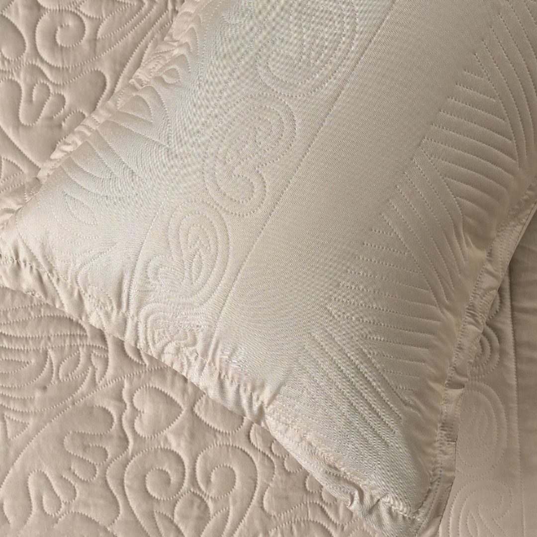 Close-up of textured beige fabric with intricate patterns