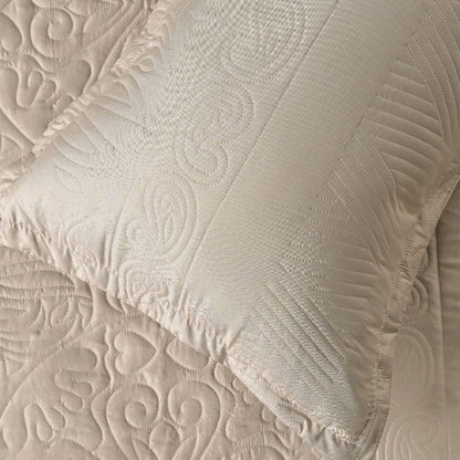 Close-up of textured beige fabric with intricate patterns