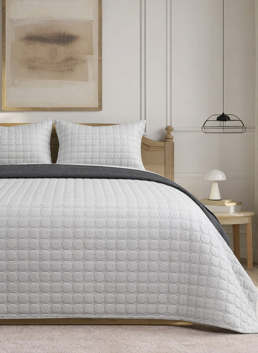 Reversible pastel quilted bedcover set by The Gharnish featuring soft, luxurious bedding with a stylish, cozy design.