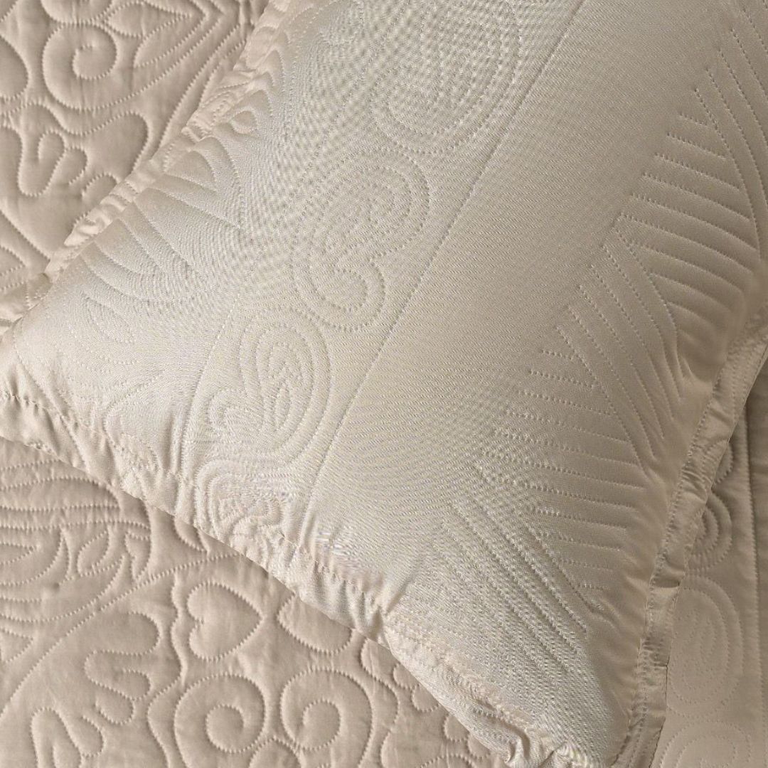 Close-up of textured beige fabric with intricate patterns